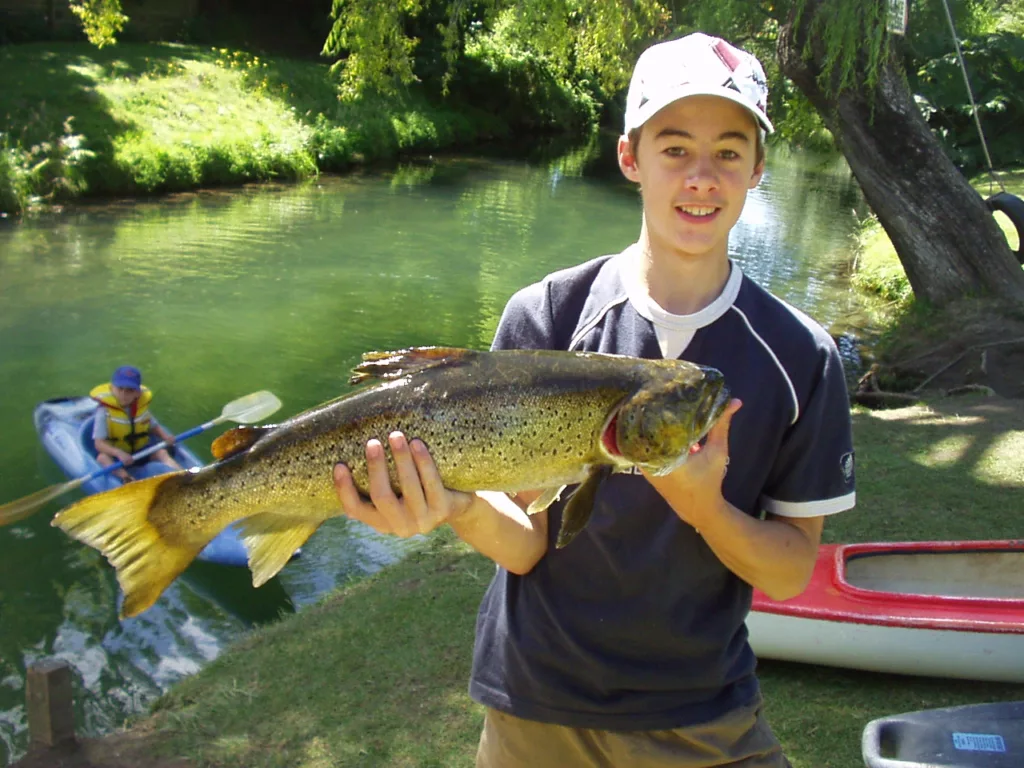 Catching and releasing at the Waiteti Trout Stream Holiday Park