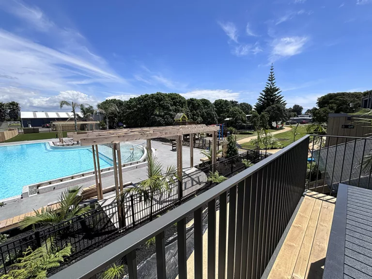 Overlooking the pool from a new poolside villa at Tasman Holiday Parks – Papamoa Beach