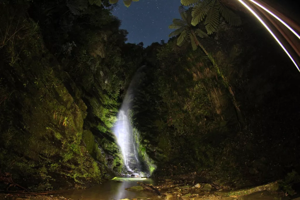 A hidden waterfall and glowworm grotto await discovery at Smiths Farm Holiday Park.